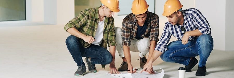 Construction engineers working over development plans | Financial Information | Tiger Finance