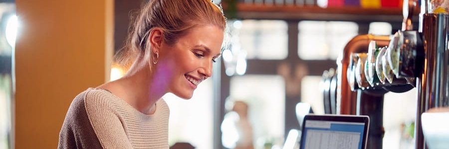 Woman checking her credit score at work | Financial Information | Tiger Finance